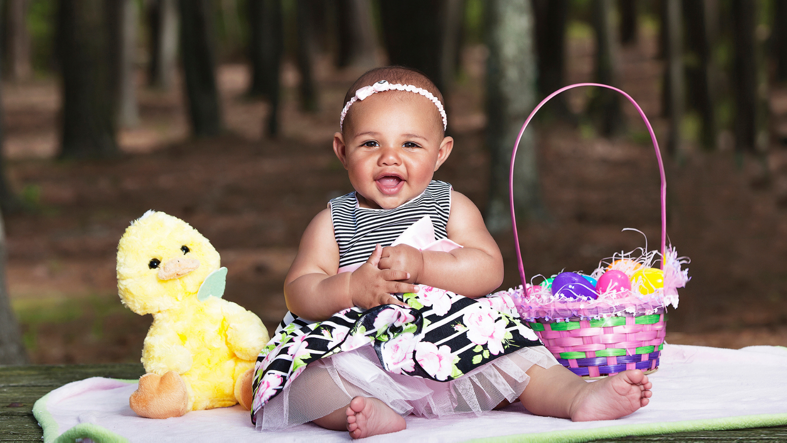 Baby on Easter with basket and check